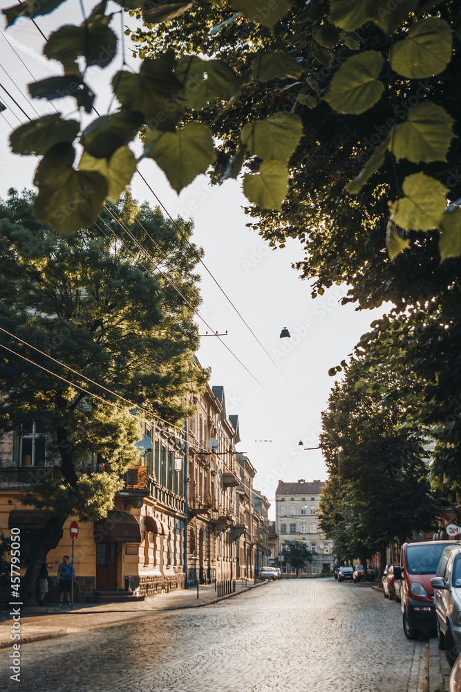 Naklejka premium Old street of Lviv city at sunrise.
