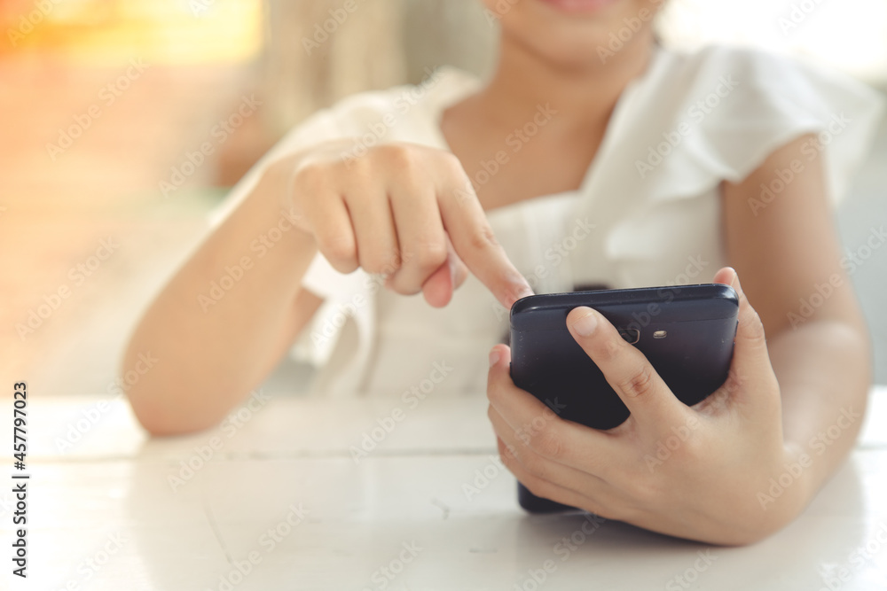 Little girl using smartphone, Social media concept. Little girl using smartphone, Social media concept.