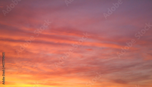 Colorful sunset in the sky with clouds.