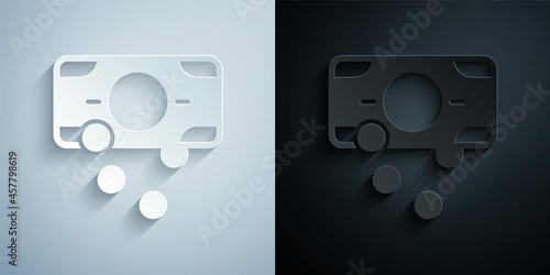 Paper cut Stacks paper money cash icon isolated on grey and black background. Money banknotes stacks. Bill currency. Paper art style. Vector