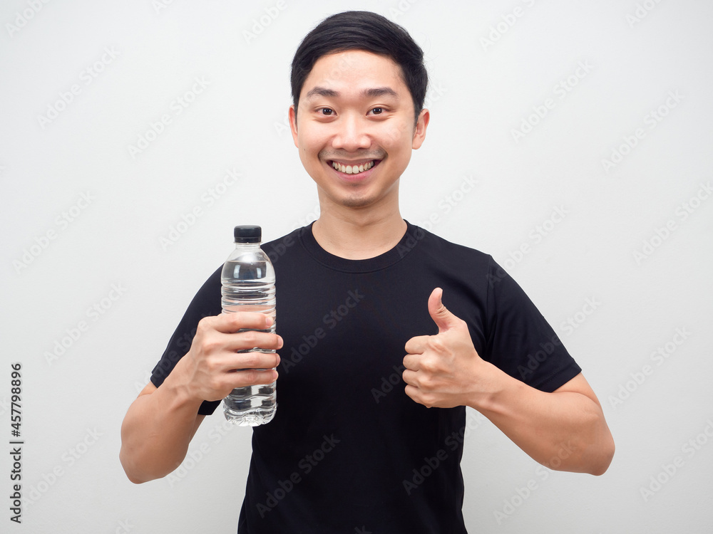 Asian man holding water bottle and thumb up happy smile,Cheerful man with water bottle Asian man holding water bottle and thumb up happy smile,Cheerful man with water bottle