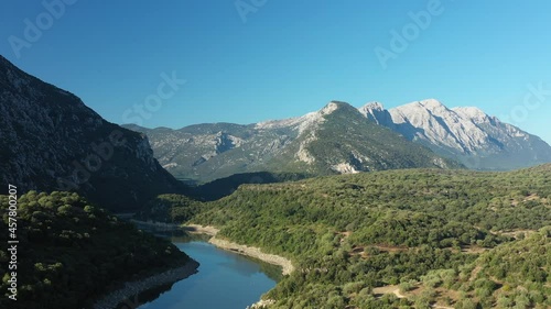 View from above, stunning aerial view of the Cedrino Lake - Lago del Cedrino, surrounded by the mountain range of Supramonte located northeast of the Gennargentu massif. Sardinia, Italy.