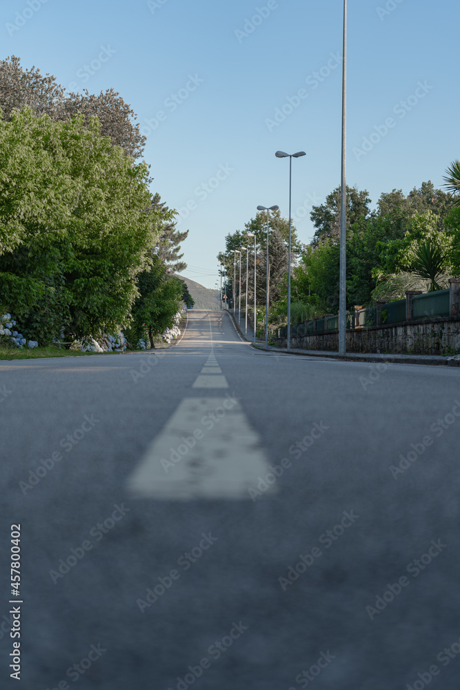 View from the ground of a long upward sloping road.