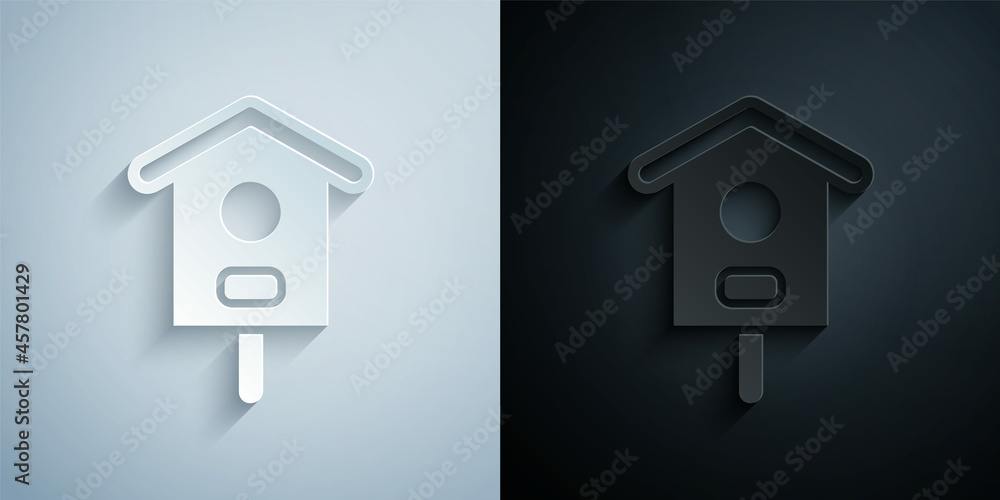 Paper cut Bird house icon isolated on grey and black background. Nesting box birdhouse, homemade building for birds. Paper art style. Vector Paper cut Bird house icon isolated on grey and black background. Nesting box birdhouse, homemade building for birds. Paper art style. Vector
