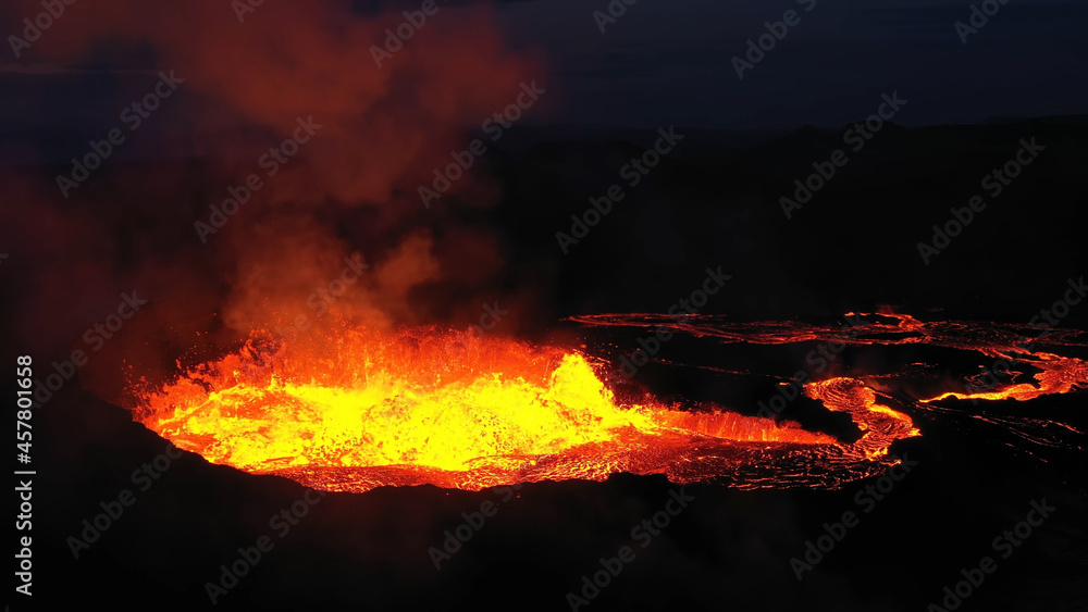 Aerial view over volcanic eruption, Night view, Mount Fagradalsfjall
lava spill out of the crater  Mount Fagradalsfjall, September 2021, Iceland 
