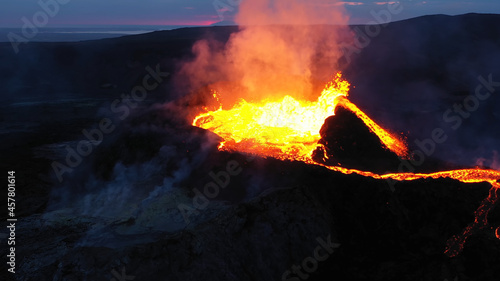 Aerial view over volcanic eruption, Night view, Mount Fagradalsfjall lava spill out of the crater Mount Fagradalsfjall, September 2021, Iceland 