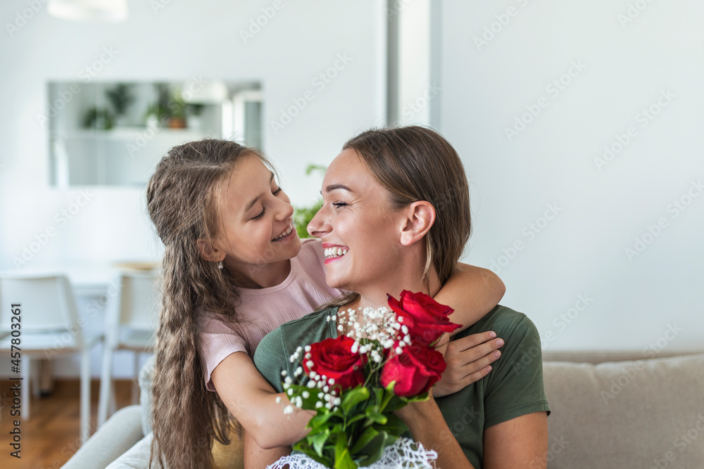 I love my you mom! Attractive young woman with little cute girl are spending time together at home, thanking for handmade card with love symbol and flowers. Happy family concept. Mother's day. I love my you mom! Attractive young woman with little cute girl are spending time together at home, thanking for handmade card with love symbol and flowers. Happy family concept. Mother's day.