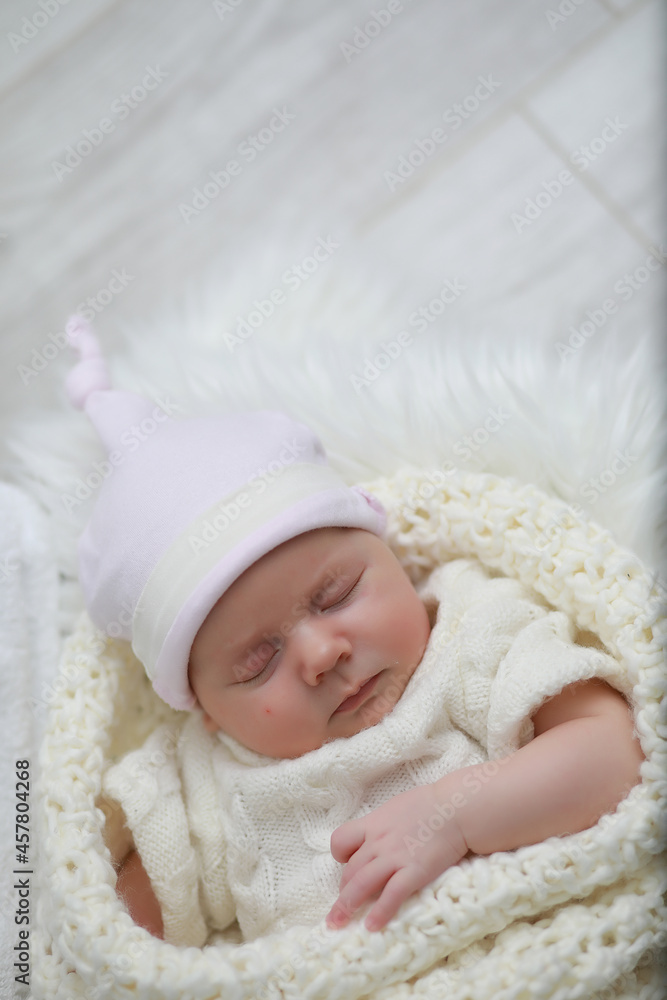 Baby newborn sleeping wrapped up in a blanket Baby newborn sleeping wrapped up in a blanket