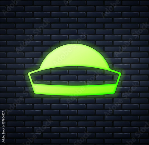 Glowing neon Sailor hat icon isolated on brick wall background. Vector