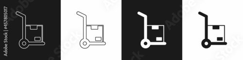Set Hand truck and boxes icon isolated on black and white background. Dolly symbol. Vector