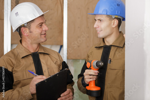 builders talking indoors