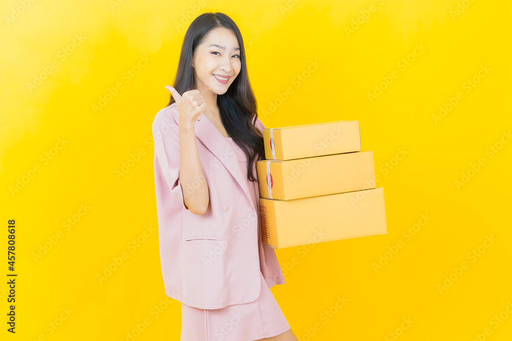 Portrait beautiful young asian woman with box ready for shipping