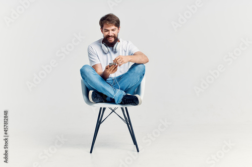 bearded man listening to music with headphones entertainment