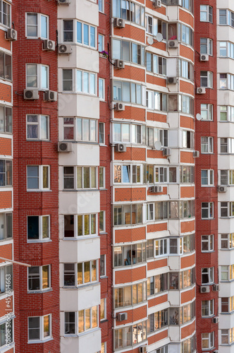 Multi-storey brick residential building with air conditioner in Moscow, Russia