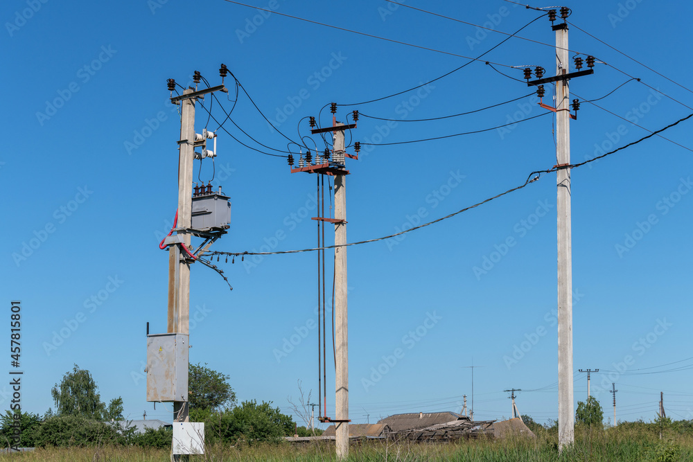 Overhead power transmission towers with ceramic and glass line insulators
