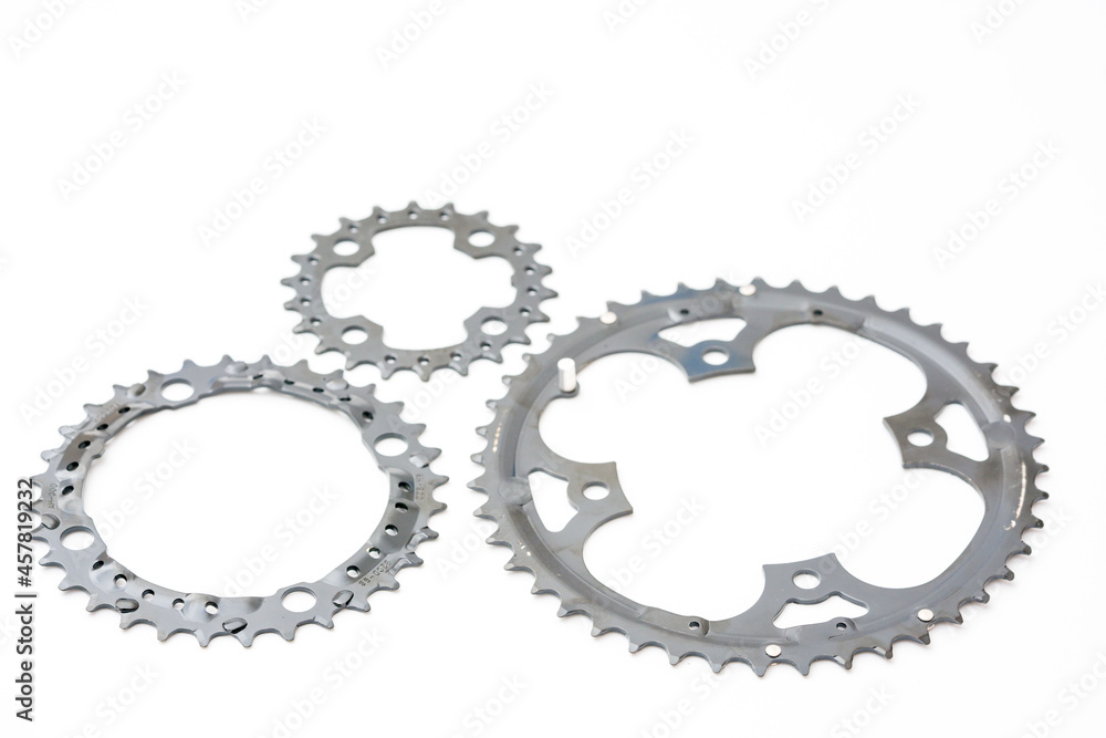 Gears, sprockets and chain of a mountain sports bike on a white background. Bicycle parts Gears, sprockets and chain of a mountain sports bike on a white background. Bicycle parts