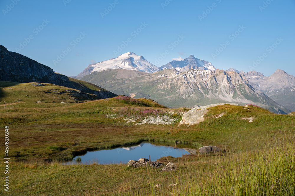Mountain landscape in summer with a lake and glaciers