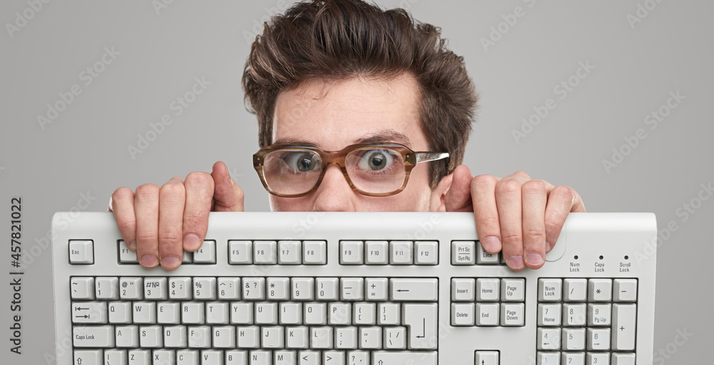 Funny geek man with keyboard - obrazy, fototapety, plakaty 