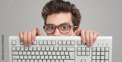 Funny geek man with keyboard photo