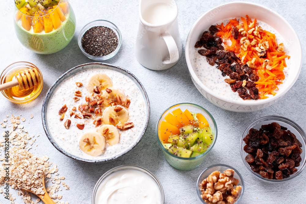 Overnight oats with fruits and nuts on concrete table top Overnight oats with fruits and nuts on concrete table top