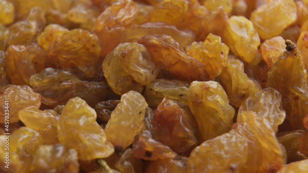 Light raisins close-up rotates in a circle Light raisins close-up rotates in a circle