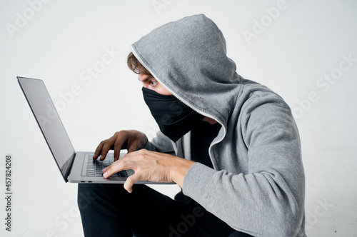 male thief hooded head hacking technology security isolated background