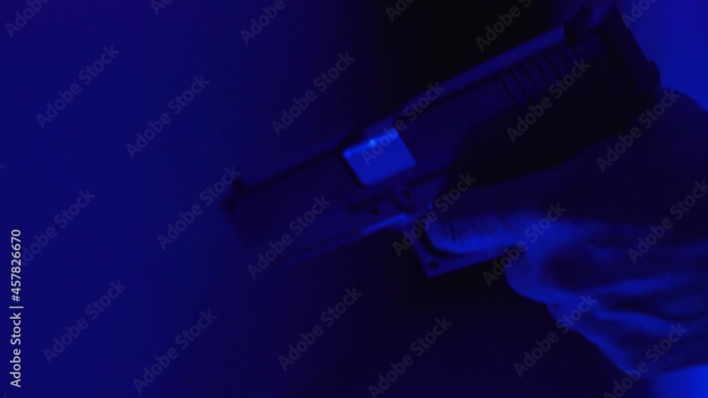 Gun shooting with red and blue background Gun shooting with red and blue background