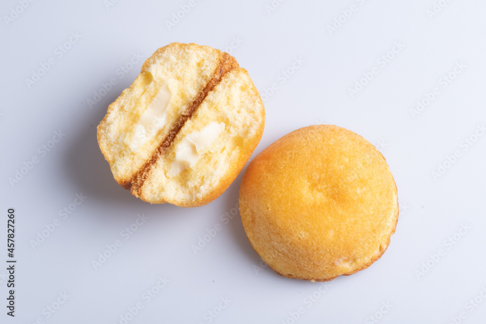 Cake stuffed with cream on a white background Cake stuffed with cream on a white background