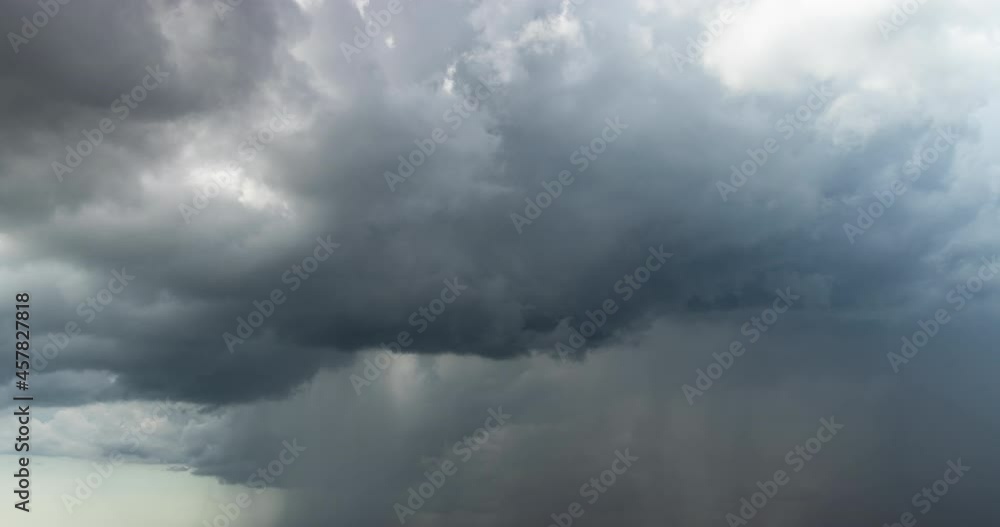 Time lapse of dramatic storm rain clouds moving fast in dramatic sky Time lapse of dramatic storm rain clouds moving fast in dramatic sky