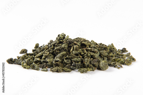 dried green tea leaf isolated on white background