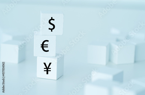 Foreign exchange. Major international currency symbol on white cube © Sean K
