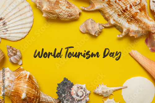 World Tourism Day incription over yellow background photo