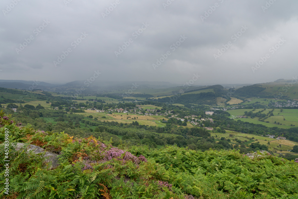 Naklejka premium Heavy cloud and mist drops down over the Derbyshire countryside on an August summer morning.