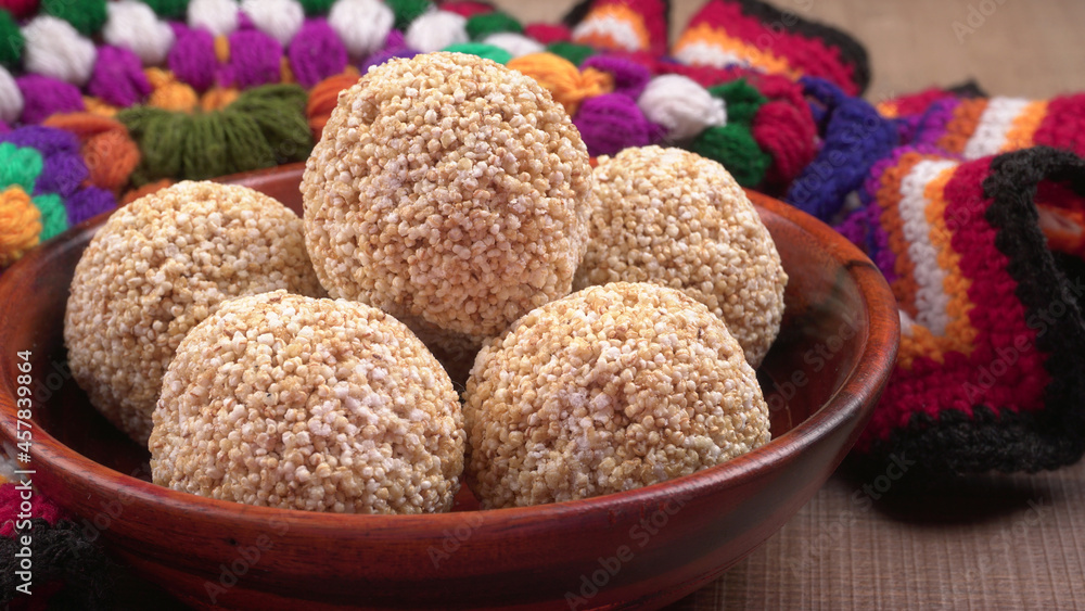 Amarnath seed, Cholai or Rajgira laddo, Also in cube shape called chikki or cake form, Indian sweet and healthy food served in a plate and bowl. Selective focus. Amarnath seed, Cholai or Rajgira laddo, Also in cube shape called chikki or cake form, Indian sweet and healthy food served in a plate and bowl. Selective focus.