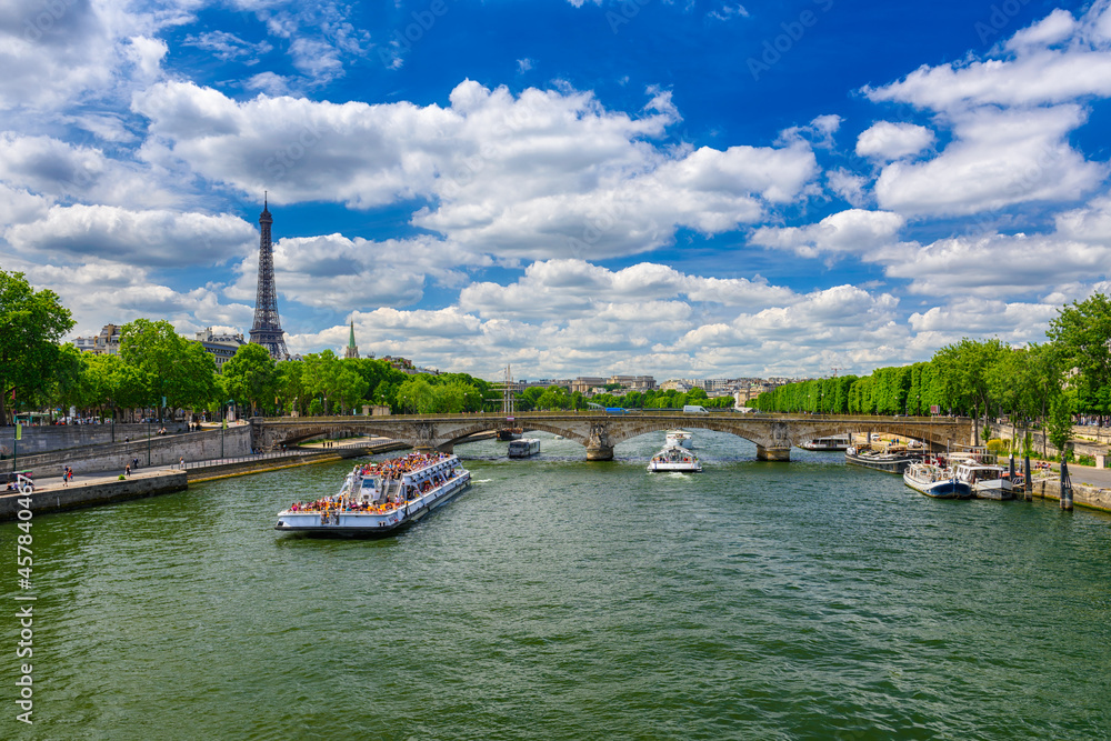 View of Eiffel tower and Seine river in Paris, France. Eiffel Tower is one of the most iconic landmarks of Paris. Cityscape of Paris