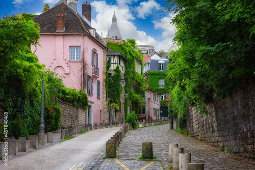 Cozy street in quarter Montmartre in Paris, France. Architecture and landmarks of Paris. Postcard of Paris