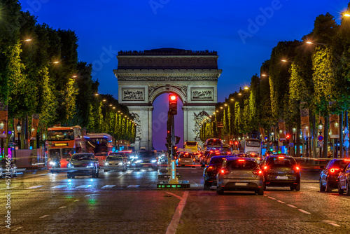 Champs-Elysees and Arc de Triomphe at night in Paris, France. Architecture and landmarks of Paris. Postcard of Paris © Ekaterina Belova