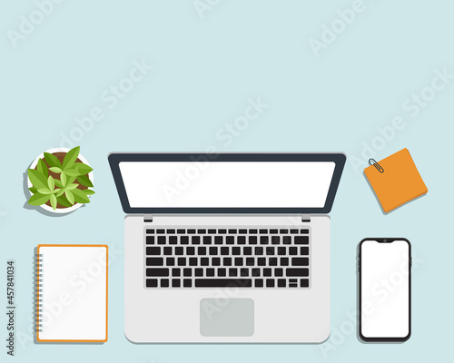 A workplace top view desk mockup. 
Mockup illustration of laptop computer, notepad and smartphone with white blank space on table