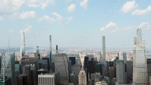 New York City, New York United States - August 29 2021: Billionaires' Row Midtown Manhattan skyscrapers with summer cloud timelapse. Video sped up by a factor of 20 times. photo