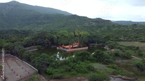 Wallpaper Mural Drone footage of the colourful Hindu Temple at Ramdara in the middle of a pond and green monsoon surroundings near Pune India. Torontodigital.ca