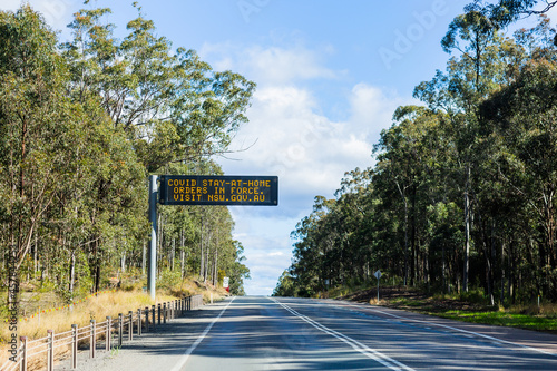 covid stay at home orders in force overhead sign on highway in NSW photo