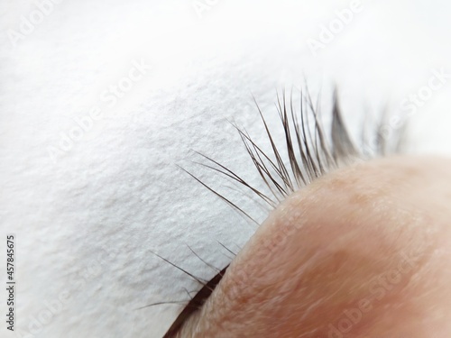 Gaps in natural lash row  lash extensions in beauty salon 