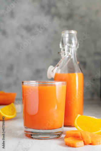 Orange and carrot juice or fruit smoothie. Healthy food, nutrition and diet concept.