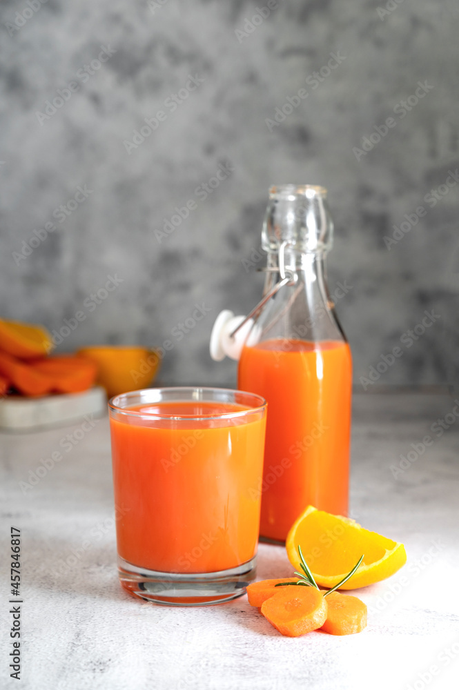 Orange and carrot juice or fruit smoothie. Healthy food, nutrition and diet concept. Orange and carrot juice or fruit smoothie. Healthy food, nutrition and diet concept.