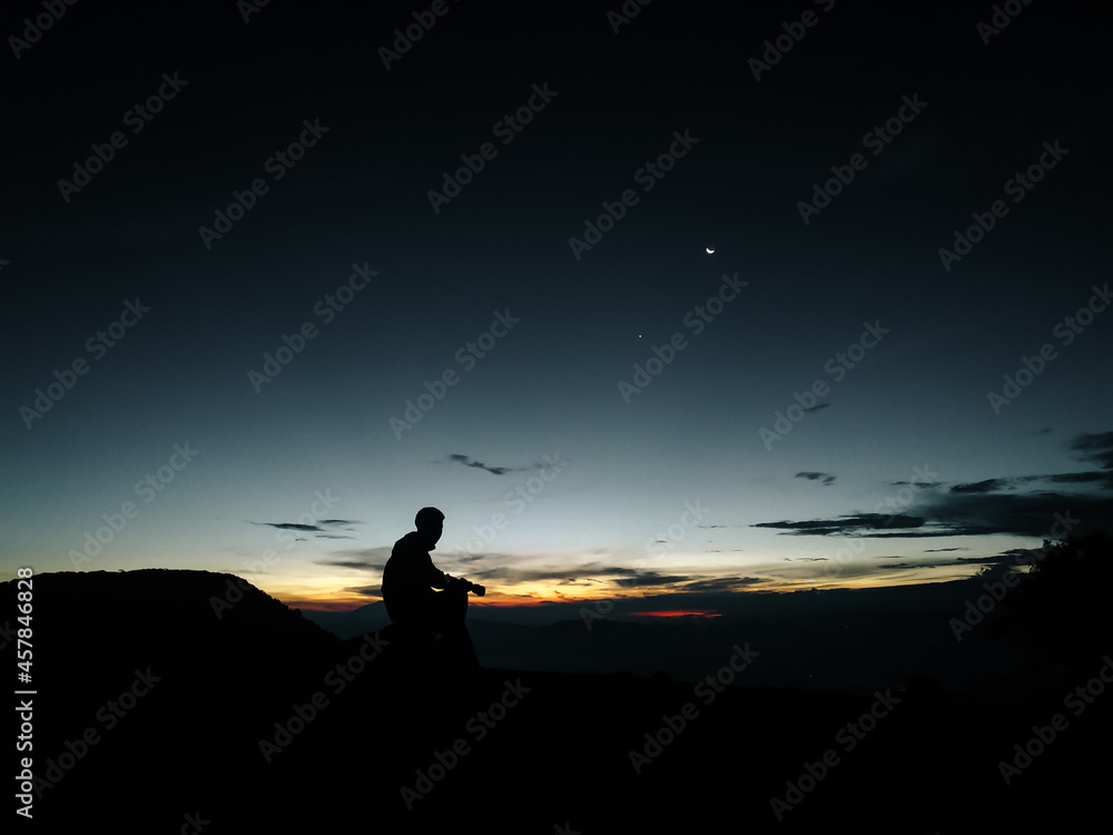 silhouette of a person on the mount