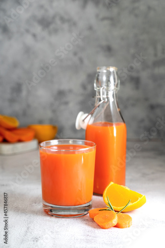 Orange and carrot juice or fruit smoothie. Healthy food, nutrition and diet concept.