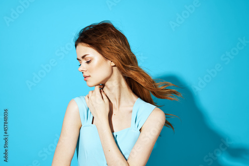 beautiful woman in a blue dress posing Studio fun model