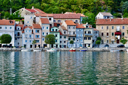 Bakar, Croatia September 2021. Colorful picturesque mediterranean Bakar city and reflex of houses on the sea