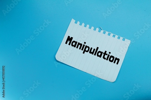 white paper torn with the word manipulation