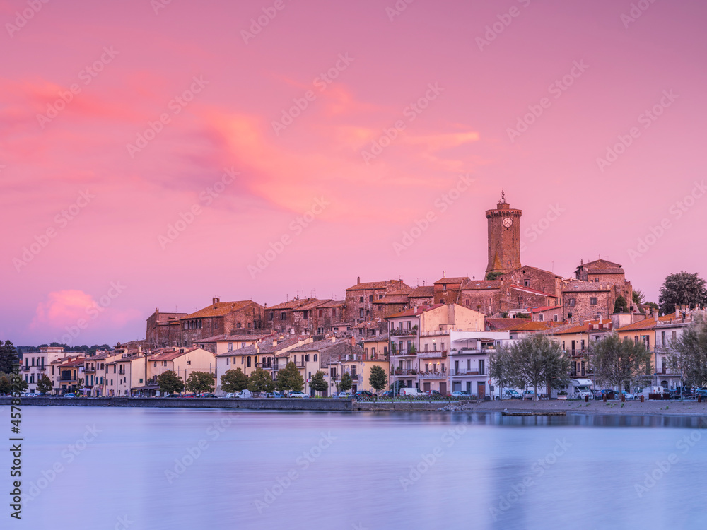 pink sky above city Marta on lake Bolsena in Italy